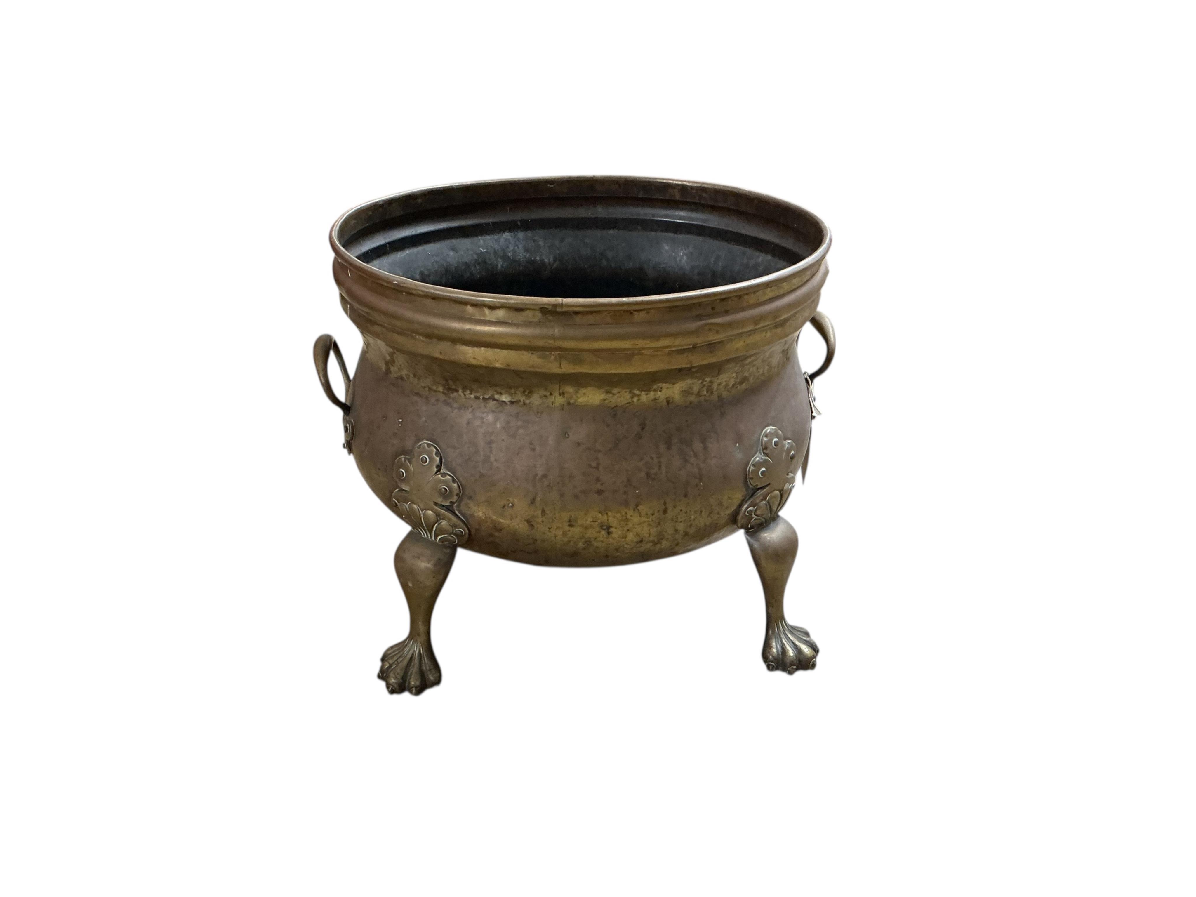 A Dutch style oval brass log bin, diameter 48cm, depth 39cm, height 37cm